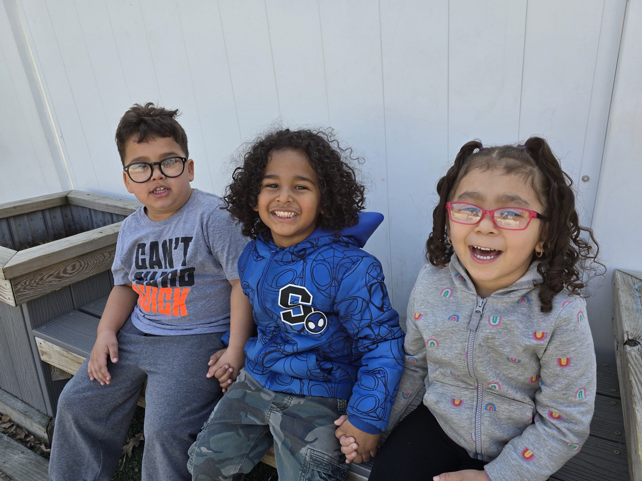 Conscious Discipline at Lancaster Early Education Center - Three young children holding hands at LEEC