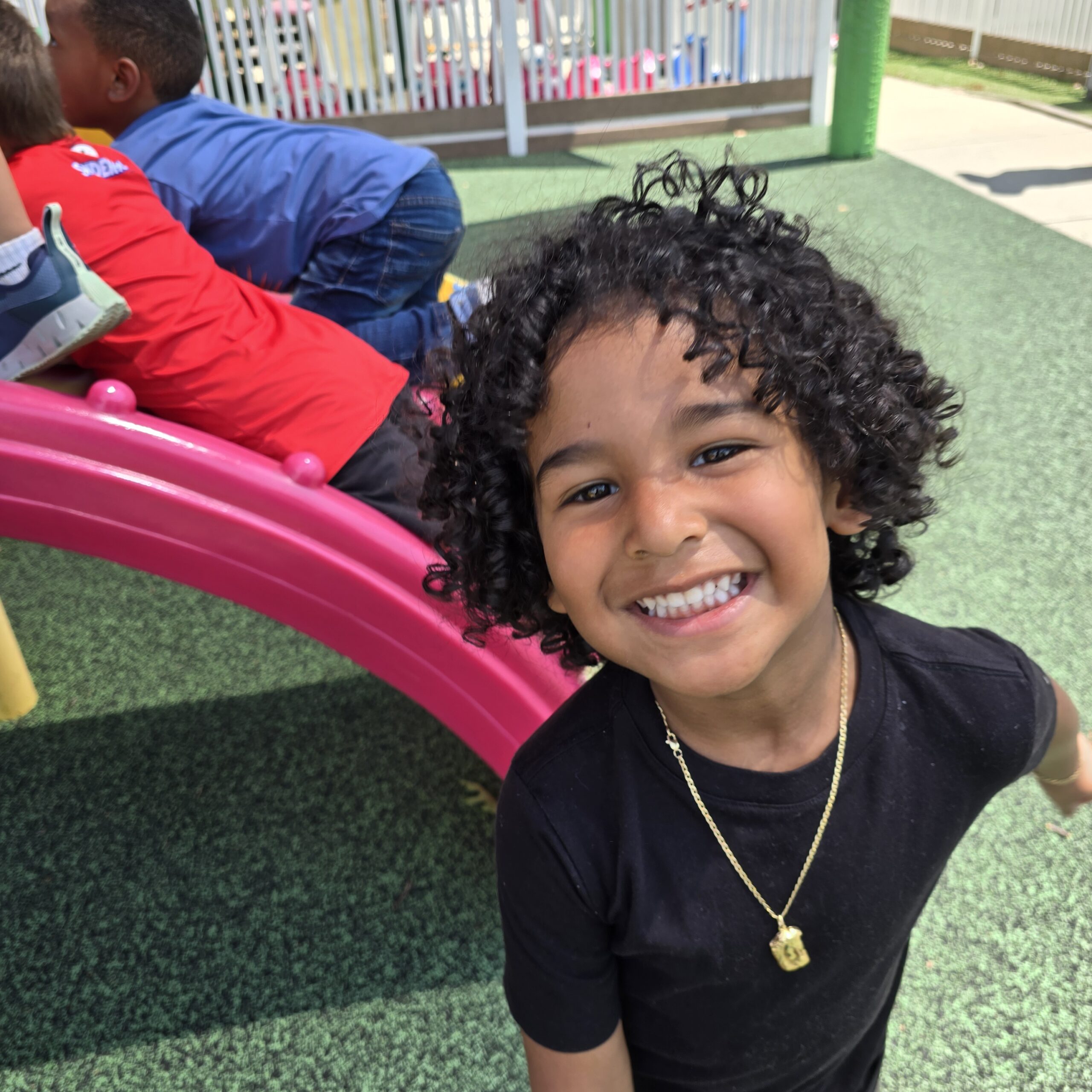 boy smiling near slide - Summertime Fun Learning and Healthy Activities for Young Children in Lancaster County, PA